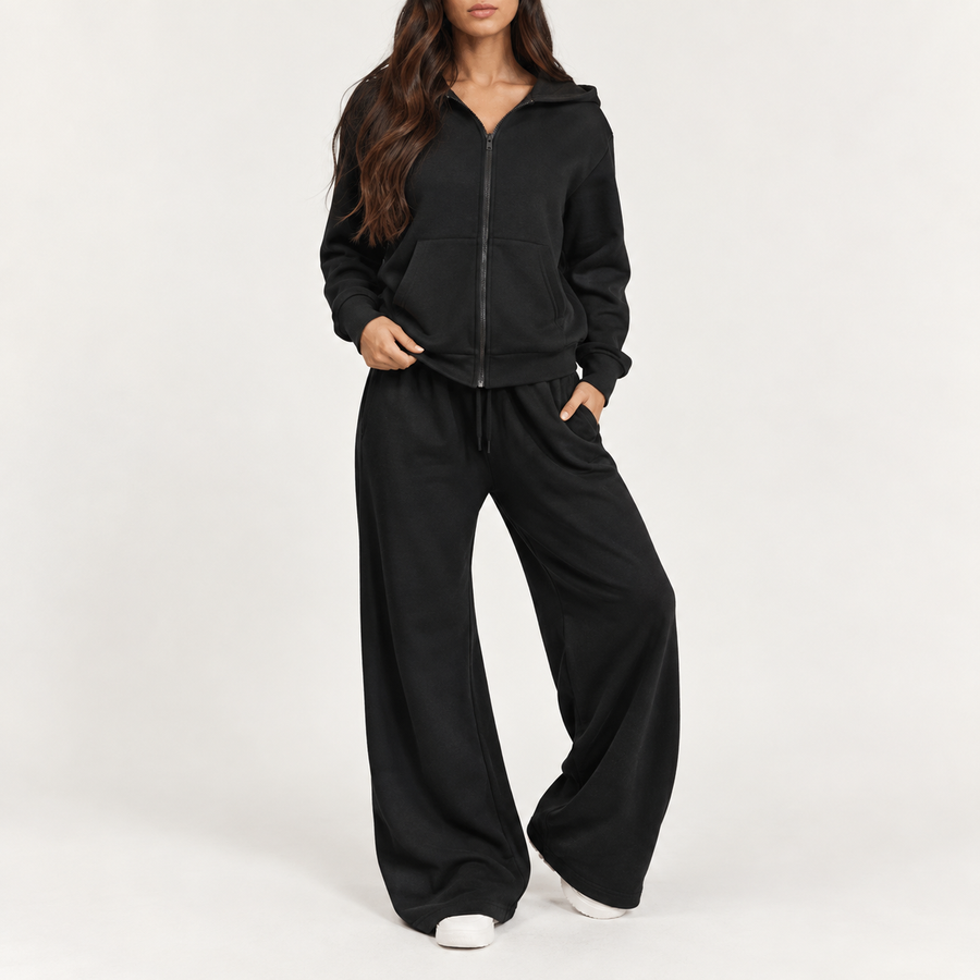 Model wearing the hooded tracksuit set in black